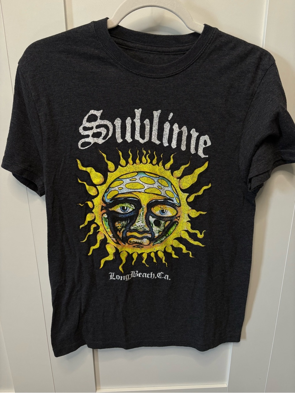 Sublime graphic t-shirt featuring the band's iconic yellow sun